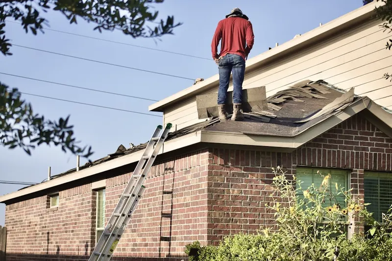 Professional roofer working on a residential roof in Lutherville